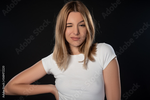 Portrait of beautiful young woman with on black background. Studio Isolated
