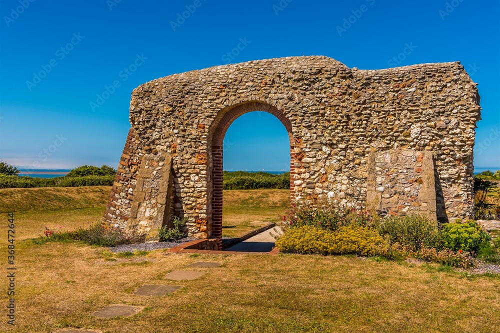 A view past the arch of the ruins of Edmunds priory out to sea at Hunstanton, Norfolk, UK