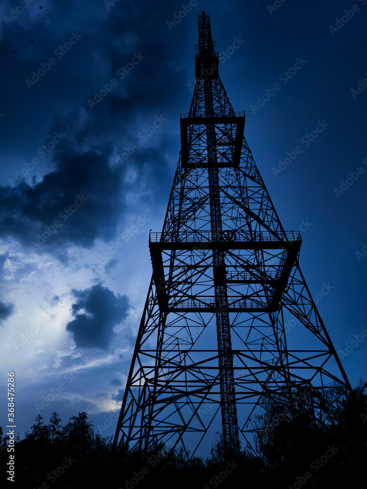 high voltage tower against the sky