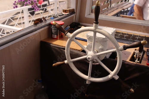 captains cabin interior with steering wheel