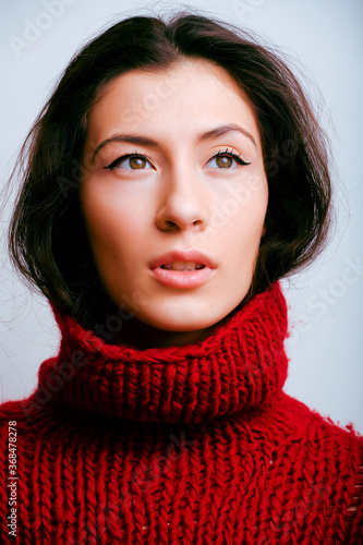 young pretty woman in sweater and scarf all over her face, lifestyle people winter concept