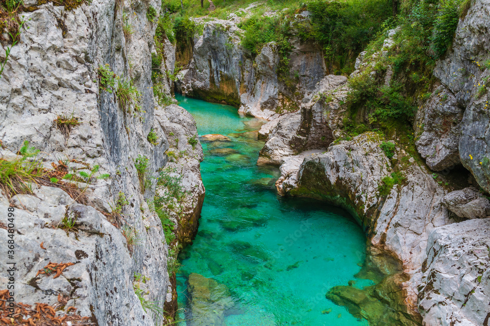 Crystal clear emerald water of Soca river in Slovenia