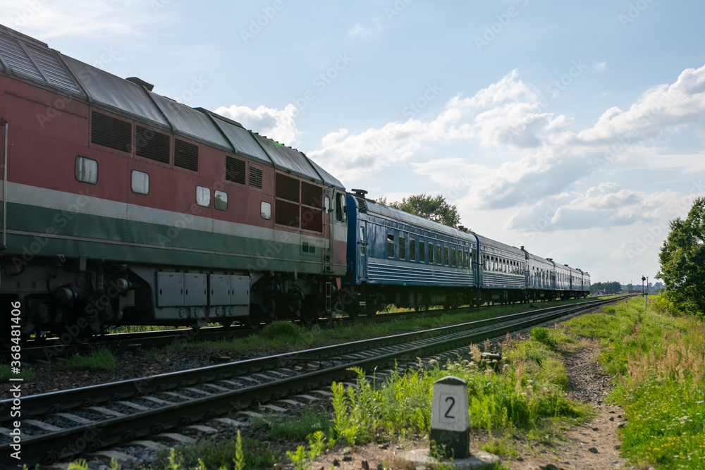 Out of date passenger train outside the city.