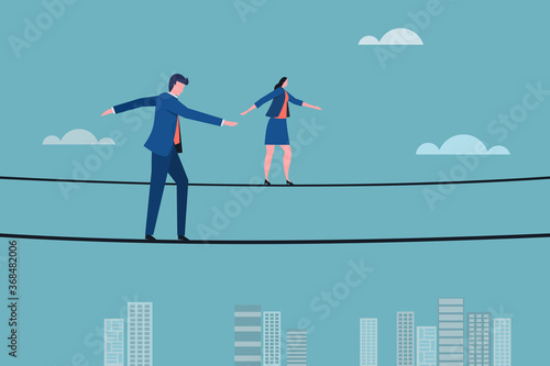 Business executives walking on a tight rope. Concept for moving ahead with risks and challenges