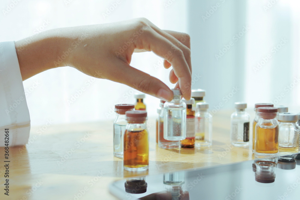 hand holding test tube with liquid hand holding test tube with liquid