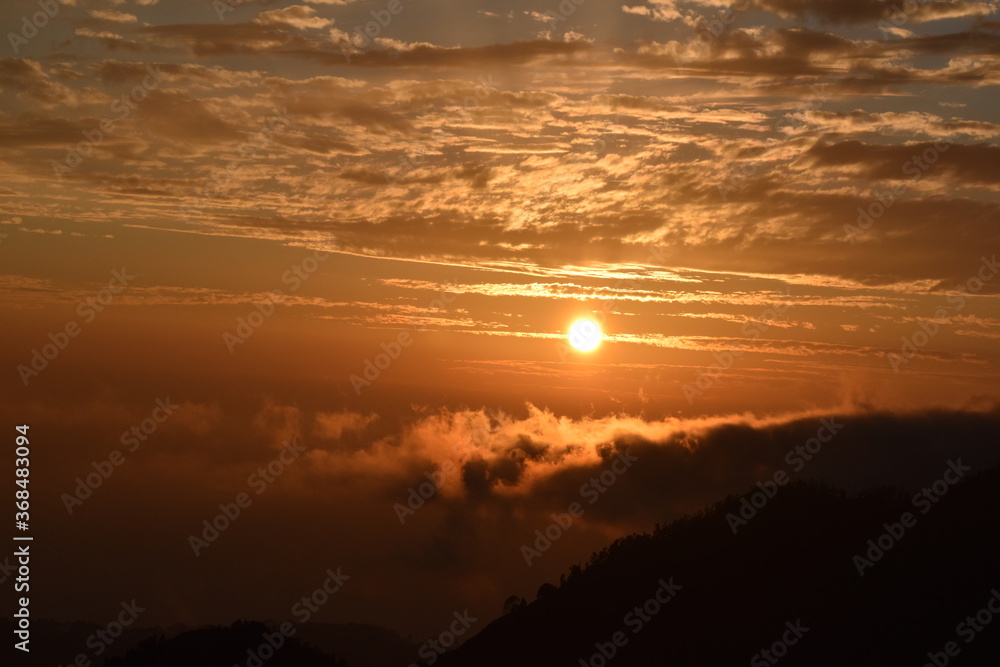 Beautiful sunset and clouds in hill Beautiful sunset and clouds in hill
