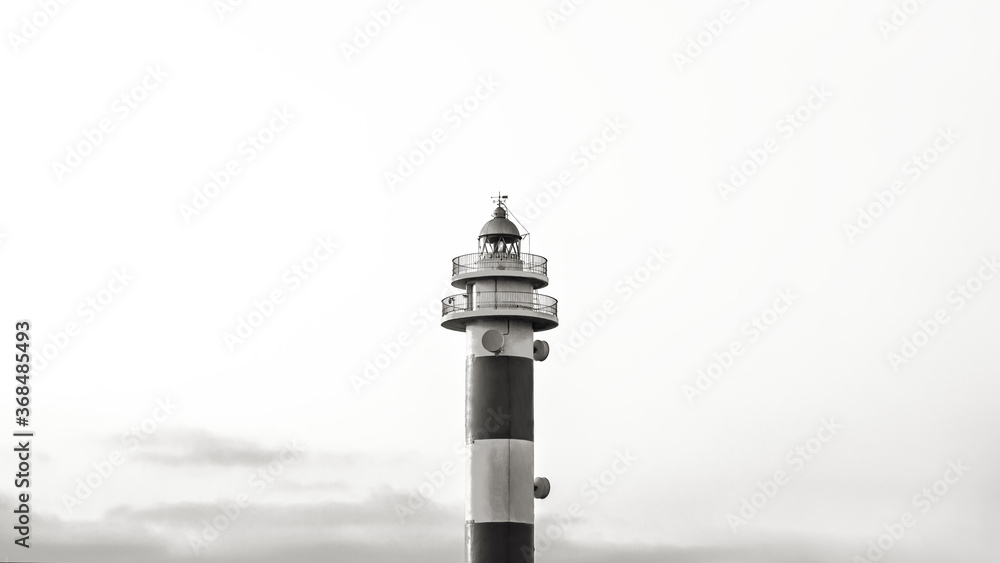 
Horizontal view background of the top of a lighthouse in black and white. Fuerteventura, Spain.