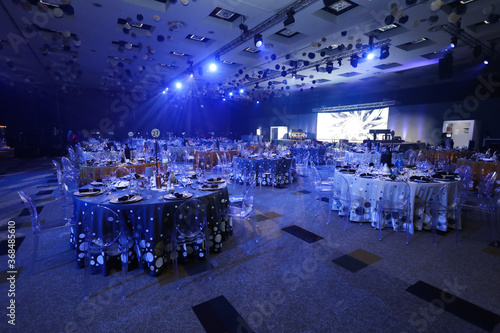 Fotografia Event setup for a function with table Decore and blue lighting.
