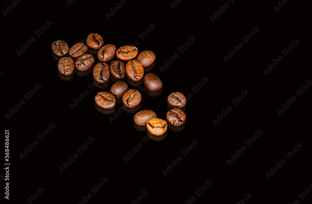 Coffee beans on the black background Coffee beans on the black background