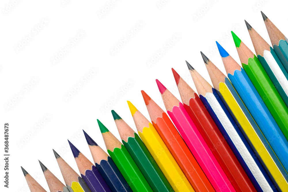 A line of different color wood pencil crayons placed on a white background A line of different color wood pencil crayons placed on a white background