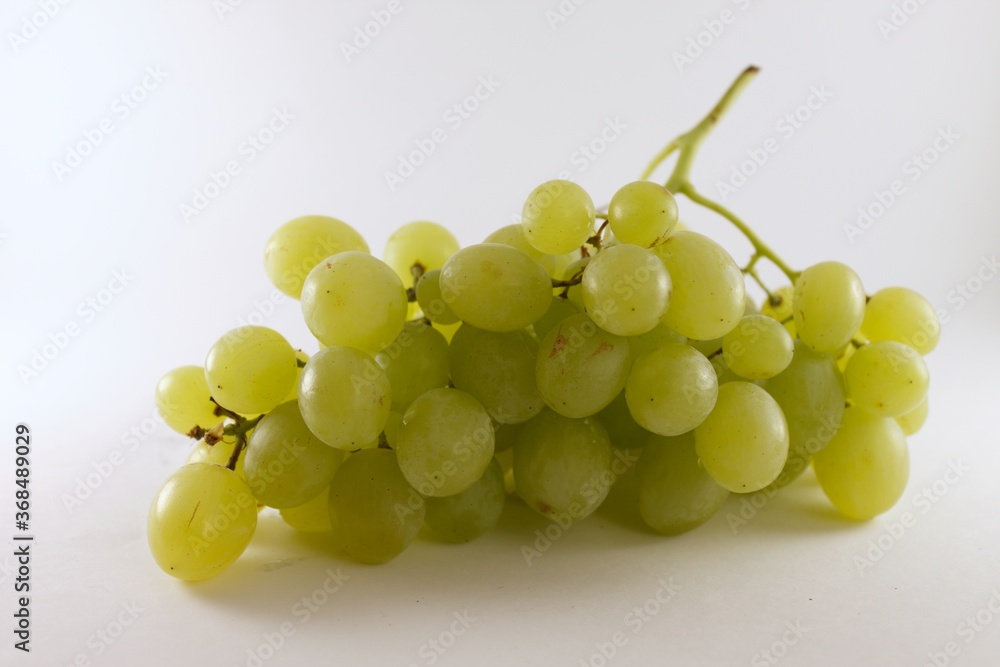Green grapes isolated on white background.