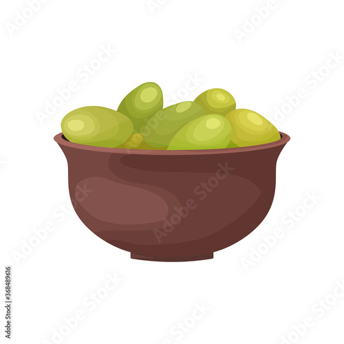 Vecton illustration of a plate full of green olives in cartoon style. Olive tree fruit in a clay bowl design for the production of olives