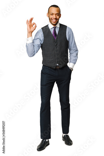 full length studio shot of a african-american businessman Isolated on white background showing OK sign