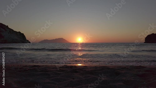 Sunset in Plathiena beach, Milos, Greece. No people. photo