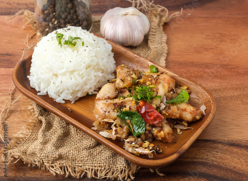 Fried chicken with garlic and pepper with rice. Thai Dish.