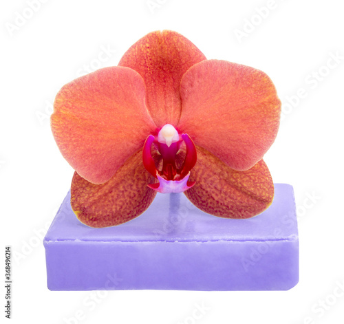 Fototapeta Naklejka Na Ścianę i Meble -  Beautiful phalaenopsis or exotic orchid flower on aroma soap isolated on the white