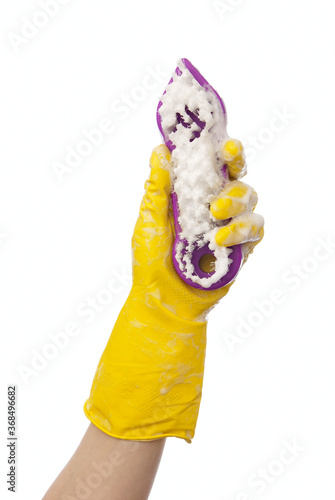 Hand in a yellow rubber glove soapy foam brush white background