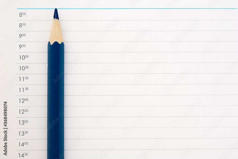 .sharp dark blue pencil on a sheet of schedule .sharp dark blue pencil on a sheet of schedule