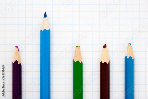 Cuadro en lienzo sharp blue pencil among blunt colored pencils on a writing-book leaf