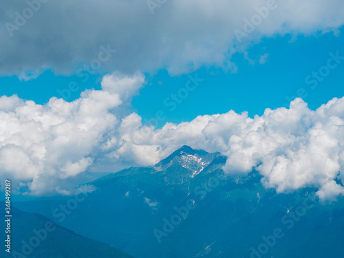 Clouds are high in the mountains. Sky.