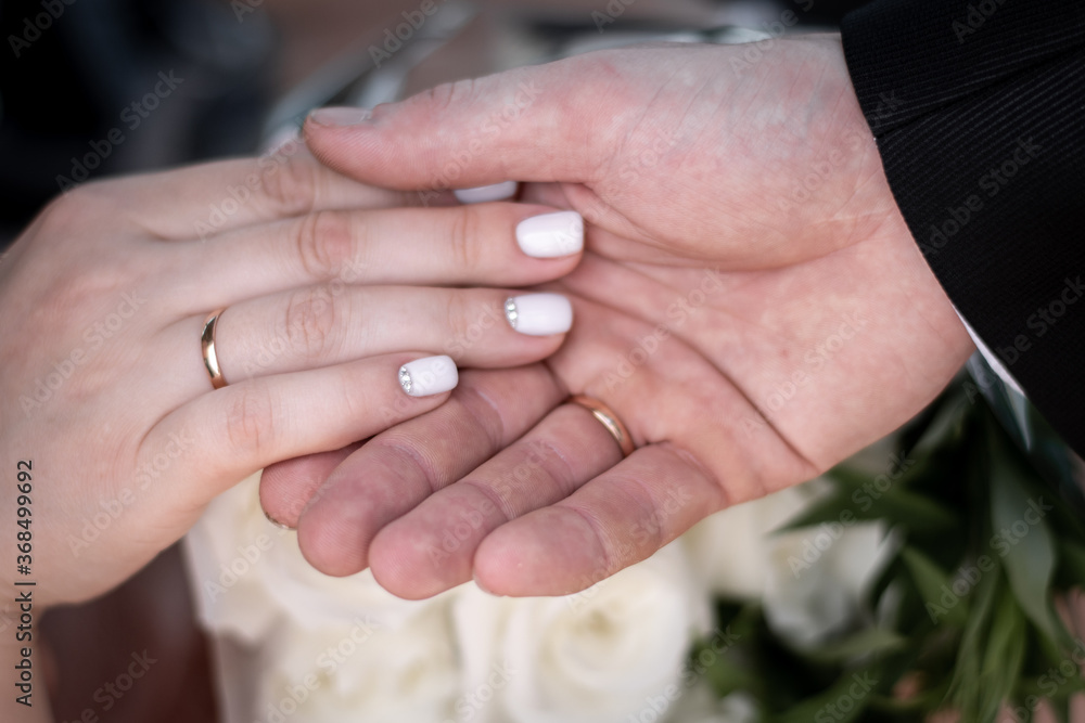 hands of the groom and bride