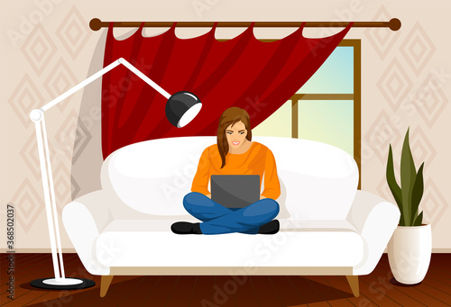 Work from home. COVID-19 virus. People work at home to prevent virus infection. Woman working on the couch. Sofa. Girl works on a laptop . Freelance, remote work, job, workplace