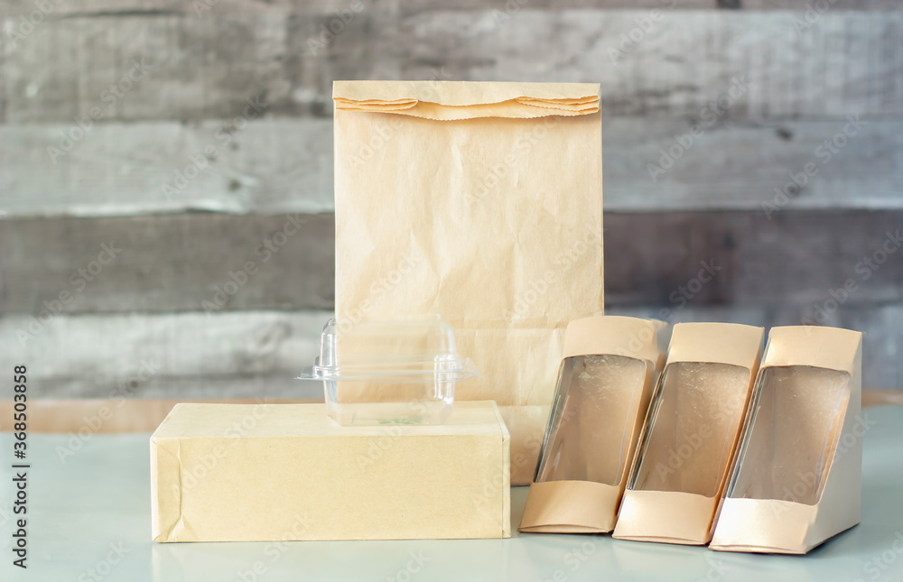 Food container takeout for delivery, for example (paper bag, box, glass, plastic) used for the background.