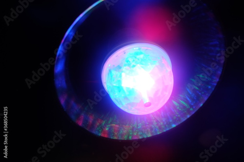 the disco ball glows with different colors