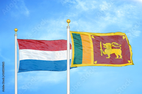 Netherlands and Sri Lanka two flags on flagpoles and blue sky photo