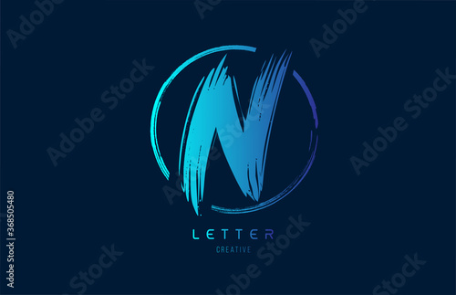 blue hand grunge brush letter N icon logo with circle. Alphabet design for a company design photo