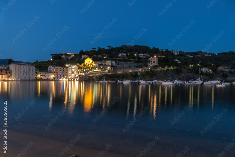 The bay of silence in Sestri Levante illuminated at twilight