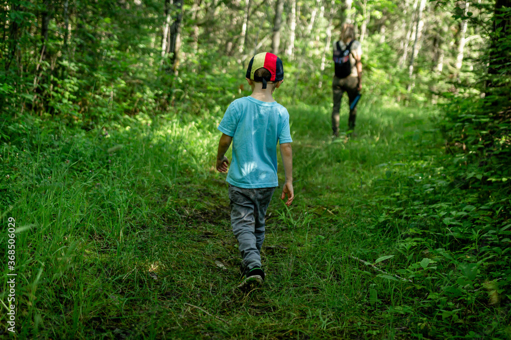 Mother and son, hiking and bird watching in Voyageurs National Park, Minnesota Mother and son, hiking and bird watching in Voyageurs National Park, Minnesota