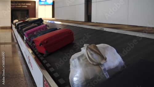 Baggage Bags and suitecases on conveyor belt at the airport photo