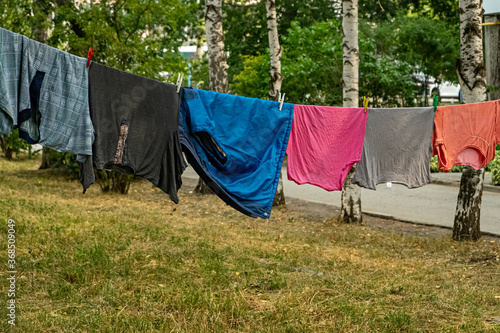 Clothes are dried on a rope in the yard
