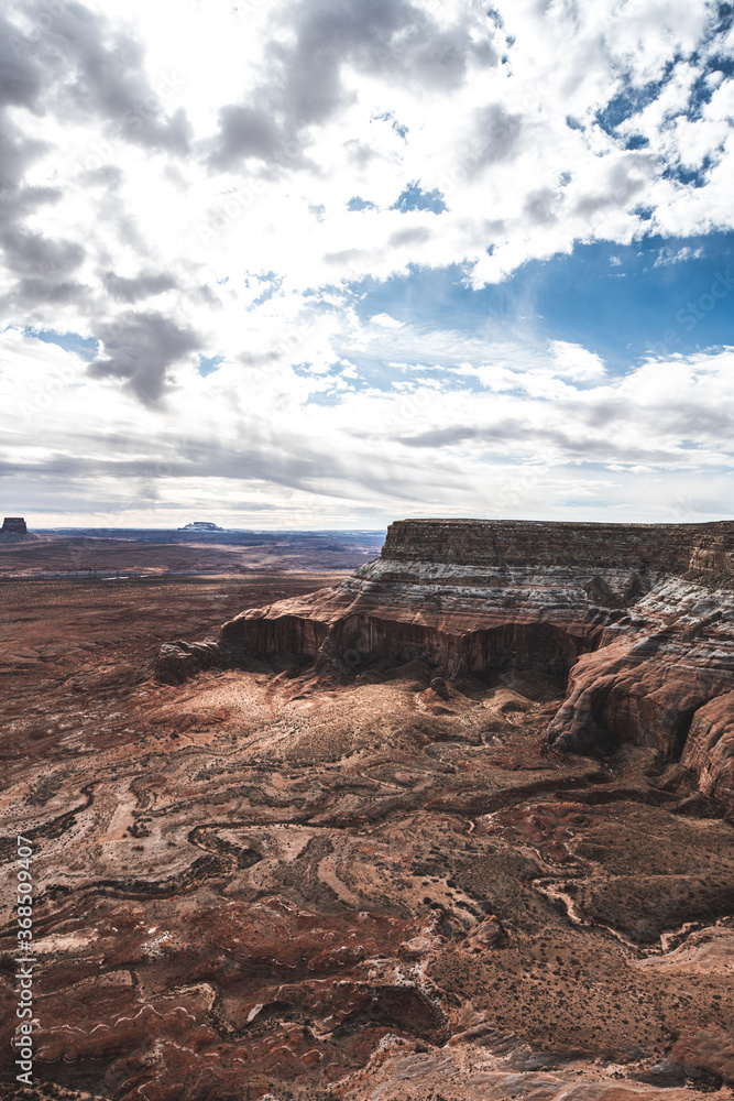 Alstrom Point at Lake Powell. Deep blue sky with lots of clouds. Lake view on the top of plateau.