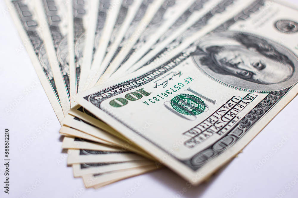 One hundred dollar bills on a white background One hundred dollar bills on a white background