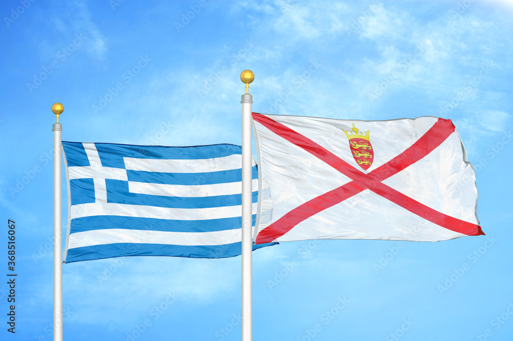 Greece and Jersey two flags on flagpoles and blue sky Greece and Jersey two flags on flagpoles and blue sky