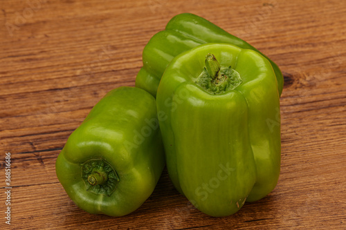 Three green bell juicy peppers