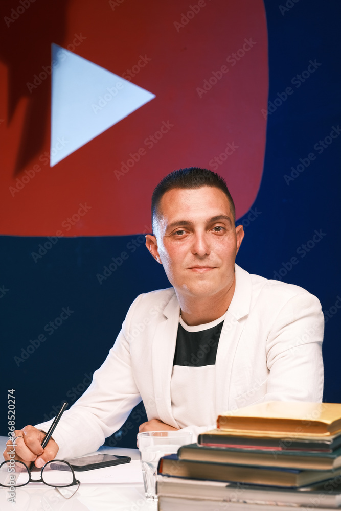 A 30 35 year old Man With A Short Haircut Wearing Glasses A Light a-30-35-year-old-man-with-a-short-haircut-wearing-glasses-a-light