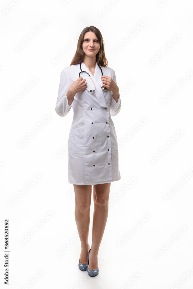 girl doctor in white robe with stethoscope on white background girl doctor in white robe with stethoscope on white background