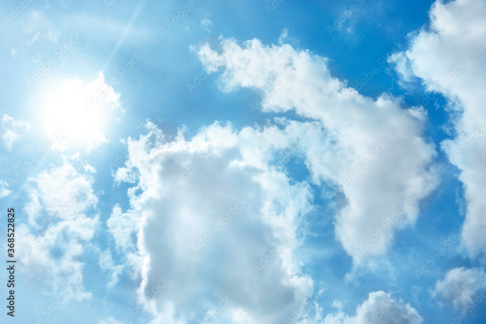Blue sky with clouds and sun. Blue sky with clouds and sun.