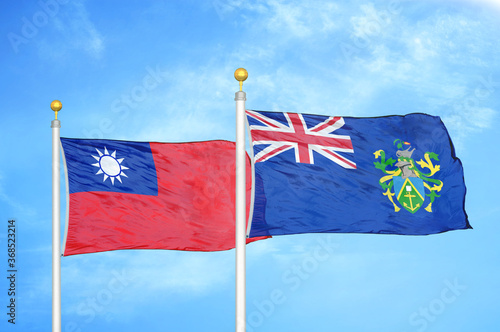 Taiwan and Pitcairn Islands two flags on flagpoles and blue sky photo