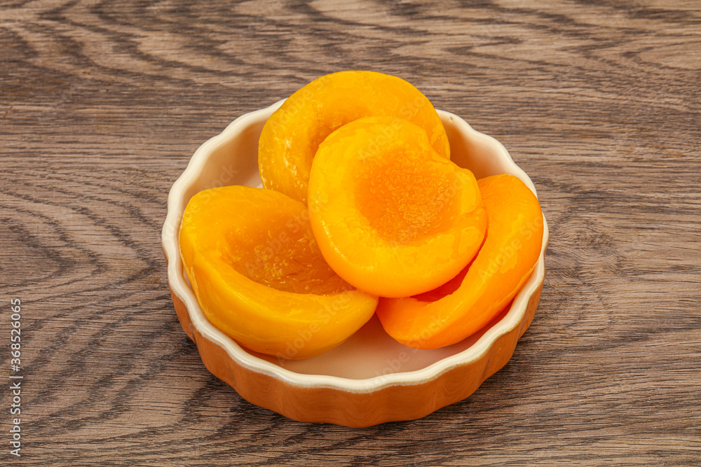 Marinated peaches fruit in the bowl Marinated peaches fruit in the bowl