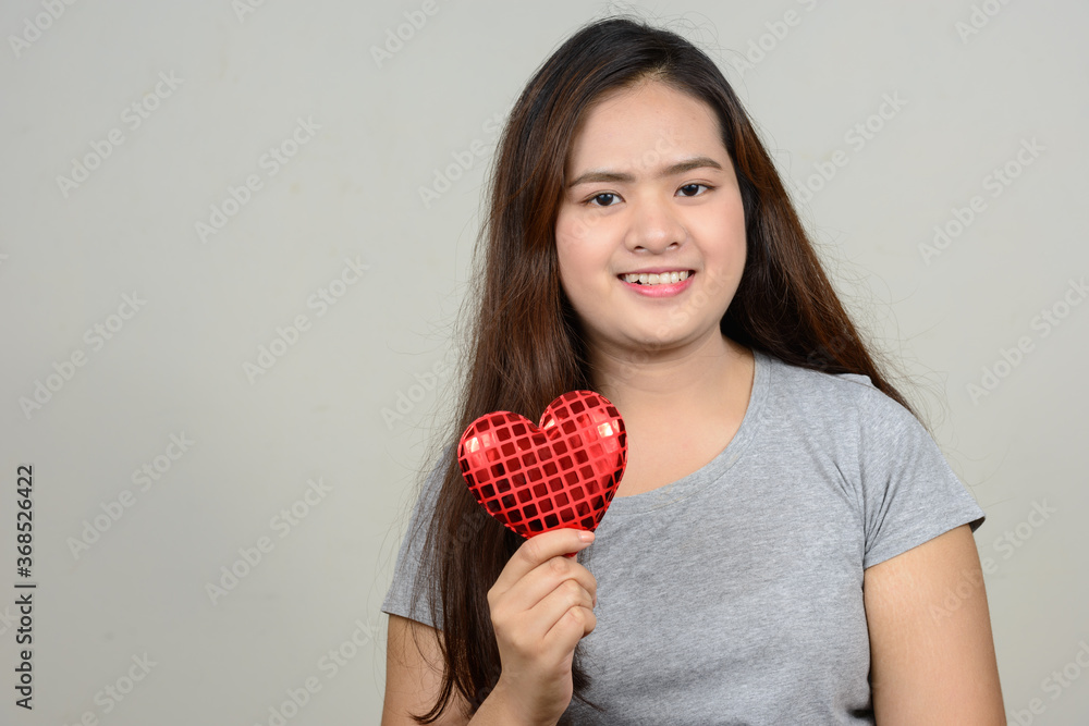 Portrait of happy young beautiful Asian woman Portrait of happy young beautiful Asian woman