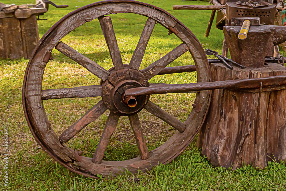 a large wooden wheel part of the mobile anvil created for military campaigns