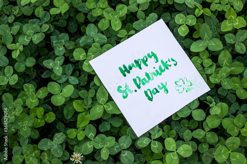 Green clover holiday border, st.Patrick's day decoration background with card Happy St. Patrick's Day