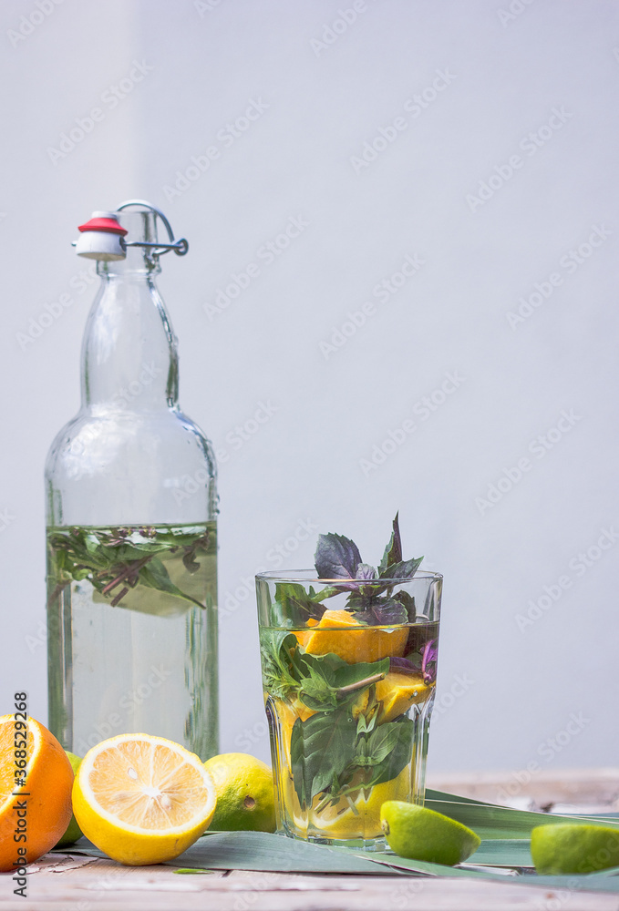 Basil smash gin alcoholic cocktail with fresh basil leaves and citrus. Basil smash gin alcoholic cocktail with fresh basil leaves and citrus.