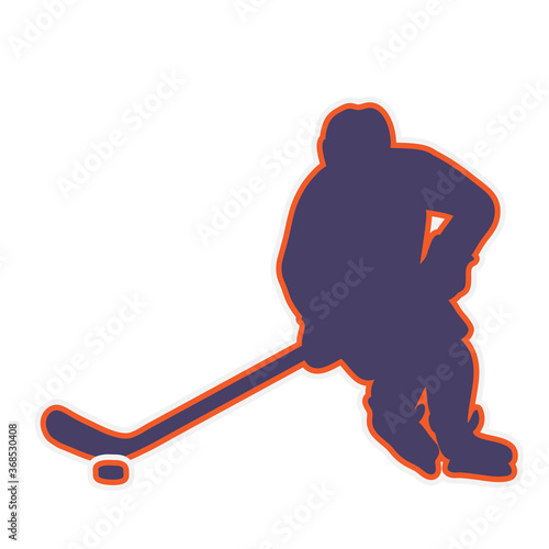 ice hockey player in action skating and kicking a puck with a stick