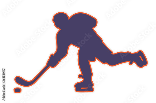 ice hockey player in action skating and kicking a puck with a stick