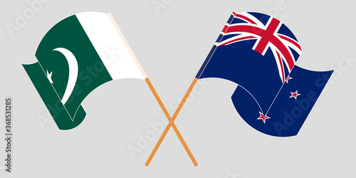 Crossed and waving flags of Pakistan and New Zealand